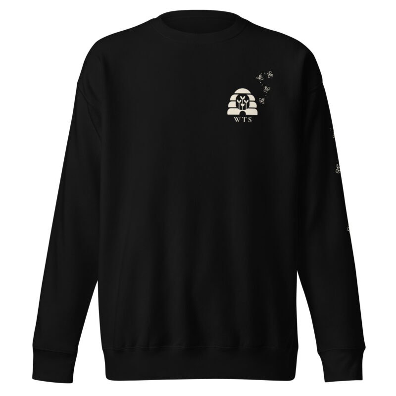 Black WTS Beehive Crewneck, front, with a small cream beehive with sprouts, WTS and a trail of bees on the left chest