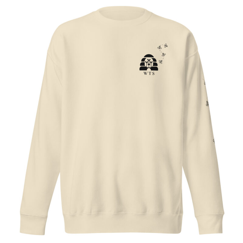 Bone WTS Beehive Crewneck, front, with a small charcoal beehive with sprouts, WTS and a trail of bees on the left chest